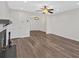 Open living space with wood-look flooring, modern lighting, and a fireplace at 219 Holcomb Ferry Rd, Roswell, GA 30076