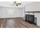 Bright living area with wood-look flooring and a cozy fireplace at 219 Holcomb Ferry Rd, Roswell, GA 30076