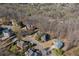 Aerial view shows the property among other homes, surrounded by mature trees in a desirable neighborhood at 5303 Whitehaven Park Se Ln, Smyrna, GA 30126