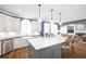 Stylish kitchen featuring white cabinets, stainless steel appliances, and a marble island at 5303 Whitehaven Park Se Ln, Smyrna, GA 30126