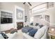 Bright living room with large windows, high ceilings, fireplace, and comfortable seating at 5303 Whitehaven Park Se Ln, Smyrna, GA 30126