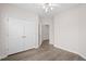 This bright bedroom has neutral walls and wood look flooring and a ceiling fan at 1955 Nocturne Dr # 3301, Alpharetta, GA 30009