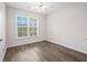 Inviting bedroom with a large window, providing lots of natural light and pleasant outdoor views at 1955 Nocturne Dr # 3301, Alpharetta, GA 30009