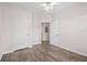 Bright bedroom featuring neutral walls, wood floors and a ceiling fan at 1955 Nocturne Dr # 3301, Alpharetta, GA 30009