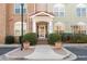 Inviting entrance with decorative shrubs and manicured landscaping enhancing curb appeal of the building at 1955 Nocturne Dr # 3301, Alpharetta, GA 30009