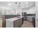 Modern kitchen with stainless steel appliances, gray cabinets and quartz countertops at 1955 Nocturne Dr # 3301, Alpharetta, GA 30009