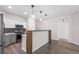 Bright kitchen featuring stylish pendant lighting, gray cabinets and wood flooring at 1955 Nocturne Dr # 3301, Alpharetta, GA 30009
