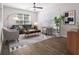 Cozy living room with a blue sofa, 2 chairs, modern decor and area rug at 1955 Nocturne Dr # 3301, Alpharetta, GA 30009