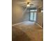 Bedroom featuring neutral walls, carpeted floor, and doors leading to balcony at 390 17Th St # 2059, Atlanta, GA 30363