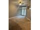 Bedroom featuring neutral walls, carpeted floor, and doors leading to balcony at 390 17Th St # 2059, Atlanta, GA 30363