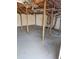 Picture features a full unfinished basement, showing support columns, insulated ceiling, and grey concrete floor at 3685 Emily Way, Atlanta, GA 30349