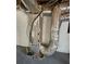 Picture features an HVAC system with ductwork and a pump, positioned in the unfinished basement at 3685 Emily Way, Atlanta, GA 30349