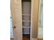Storage closet with shelving and partial view of bathroom at 3685 Emily Way, Atlanta, GA 30349