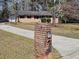 Classic brick exterior with a long driveway leading to the garage at 3685 Emily Way, Atlanta, GA 30349