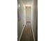 Clean hallway with wood-look flooring and simple decor at 3685 Emily Way, Atlanta, GA 30349
