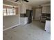 Bright kitchen featuring white cabinets, stainless steel appliances, and marble tile flooring at 3685 Emily Way, Atlanta, GA 30349