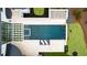 Aerial view of a luxurious backyard showcasing a pool, manicured lawn, and patio area at 5245 Kenbrook Way, Sandy Springs, GA 30327