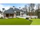 Aerial view of a home featuring a swimming pool and perfectly manicured lawn at 5245 Kenbrook Way, Sandy Springs, GA 30327