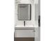 Modern bathroom featuring a sleek vanity with black hardware, a framed mirror, and marble accents at 5245 Kenbrook Way, Sandy Springs, GA 30327