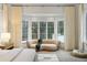 Bedroom bay window featuring a comfortable sitting area with natural light creating a cozy ambiance at 5245 Kenbrook Way, Sandy Springs, GA 30327