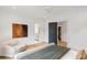 Bedroom with neutral colors, hardwood floors, a gray door and ensuite bathroom at 5245 Kenbrook Way, Sandy Springs, GA 30327