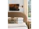 Bedroom featuring a plush headboard, decorative pillows, and a window with a view at 5245 Kenbrook Way, Sandy Springs, GA 30327