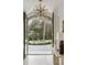 Arched doorway view of the fountain and circular driveway, showcasing the home's elegant entrance at 5245 Kenbrook Way, Sandy Springs, GA 30327