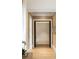 A light hallway with neutral decor, hardwood floors, and a view into another room at 5245 Kenbrook Way, Sandy Springs, GA 30327