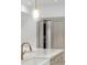 Custom kitchen with marble countertops, designer hardware, and an open cabinet at 5245 Kenbrook Way, Sandy Springs, GA 30327