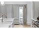 Custom kitchen with marble countertops, designer hardware, and an open cabinet at 5245 Kenbrook Way, Sandy Springs, GA 30327