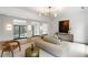 Elegant living room featuring modern lighting, stylish furniture, and large windows with views at 5245 Kenbrook Way, Sandy Springs, GA 30327