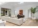 Living room with high ceilings, an expansive sofa, and stylish decor elements at 5245 Kenbrook Way, Sandy Springs, GA 30327