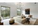 Bright living room features stylish furniture, modern lighting, and scenic views from large windows at 5245 Kenbrook Way, Sandy Springs, GA 30327