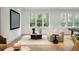 Bright living room with large windows, stylish furniture, and a cozy seating area at 5245 Kenbrook Way, Sandy Springs, GA 30327