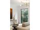 Bright living room boasts modern lighting, stylish console table, and elegant black-framed windows at 5245 Kenbrook Way, Sandy Springs, GA 30327