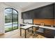 Stylish home office features built-in cabinets, a large arched window, and sleek fixtures at 5245 Kenbrook Way, Sandy Springs, GA 30327