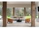 Relaxing outdoor patio with stylish seating and views of a lush backyard at 5245 Kenbrook Way, Sandy Springs, GA 30327