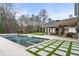 An outdoor pool area with a patio and seating areas, perfect for relaxation and entertaining guests at 5245 Kenbrook Way, Sandy Springs, GA 30327
