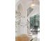 Modern staircase with curved railing and large window providing natural light at 5245 Kenbrook Way, Sandy Springs, GA 30327