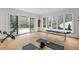 Workout room with floor to ceiling windows, hardwood floors, and space for exercise equipment at 5245 Kenbrook Way, Sandy Springs, GA 30327