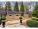 Landscaped backyard featuring a beautiful, tall fence and lush greenery at 5726 Taylor Way, Sandy Springs, GA 30342