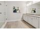 Bright bathroom featuring a double sink vanity and tiled floors at 5726 Taylor Way, Sandy Springs, GA 30342