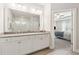 Elegant bathroom with a double vanity and a glass-enclosed shower visible through the door at 5726 Taylor Way, Sandy Springs, GA 30342