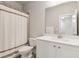 Well-lit bathroom with a shower-tub combo, a framed mirror, and a white vanity at 5726 Taylor Way, Sandy Springs, GA 30342
