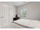 Bedroom featuring a double closet, natural light, and dedicated desk area at 5726 Taylor Way, Sandy Springs, GA 30342