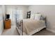 Cozy bedroom featuring neutral carpet, a metal bed frame, and bright light from the window at 5726 Taylor Way, Sandy Springs, GA 30342