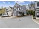 Charming gray two-story townhome with a two-car garage and beautifully landscaped front yard at 5726 Taylor Way, Sandy Springs, GA 30342