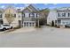 Well-kept gray two-story townhome with a two-car garage and pleasing exterior design at 5726 Taylor Way, Sandy Springs, GA 30342