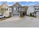 Charming gray two-story townhome with a two-car garage and inviting curb appeal at 5726 Taylor Way, Sandy Springs, GA 30342