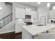 Updated kitchen with white cabinets, stainless steel appliances, and quartz countertops at 5726 Taylor Way, Sandy Springs, GA 30342